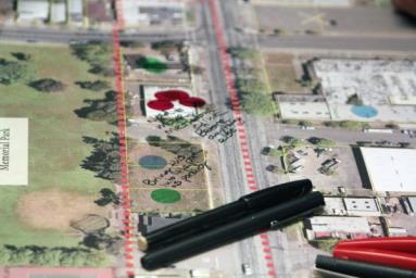 The members of the audience used pens and multicolored stickers to mark different aspects of the section of Cutting Boulevard that they wanted to change, or felt were assets to the area. (Photo by Stephen Hobbs)